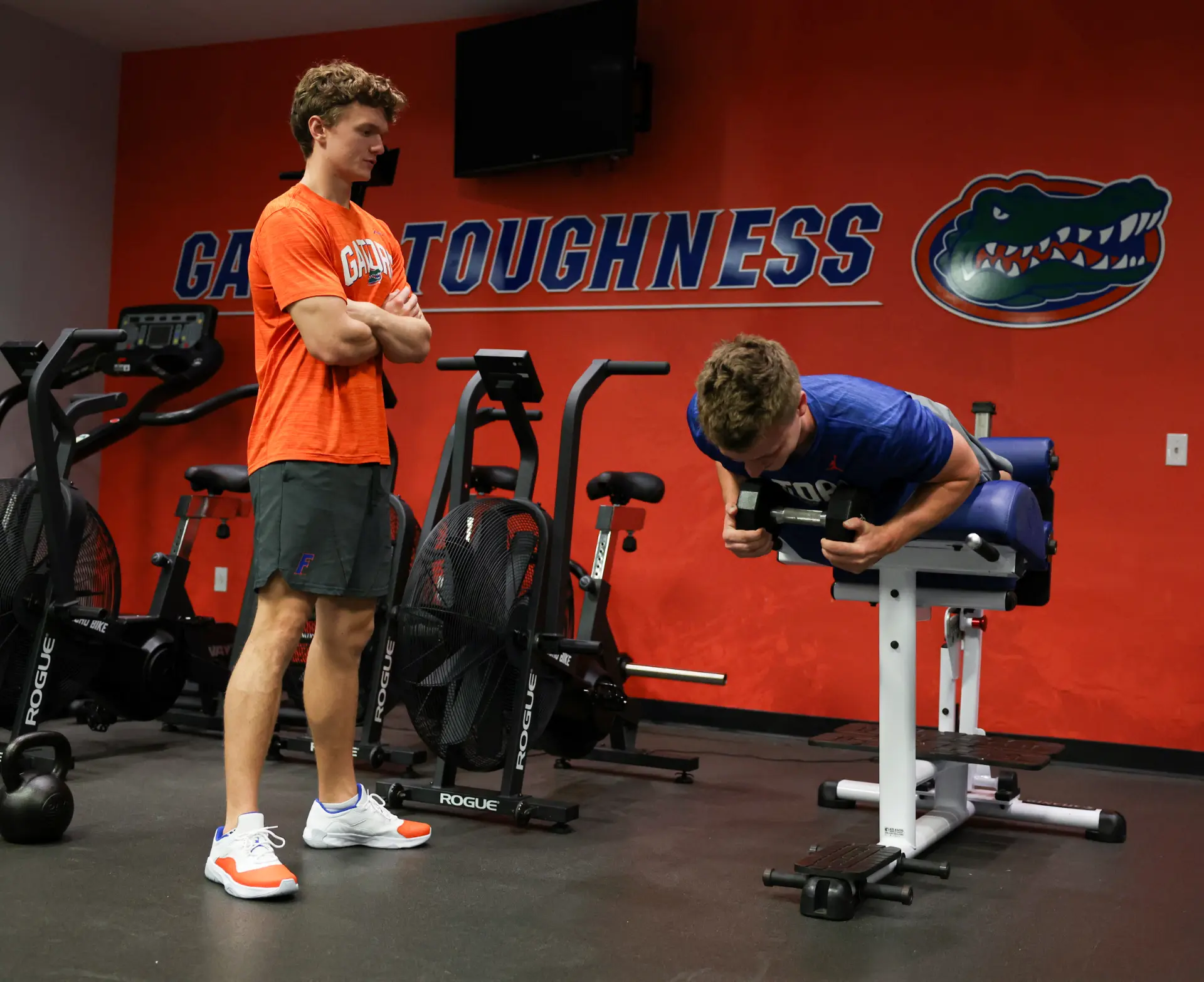Mac coaching an athlete during a UF training session
