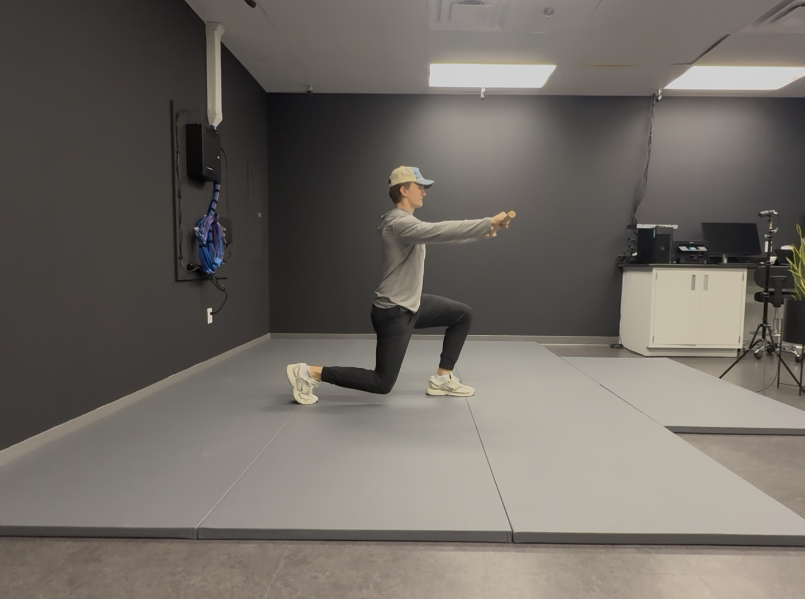Athlete performing a kneeling assessment in the gym
